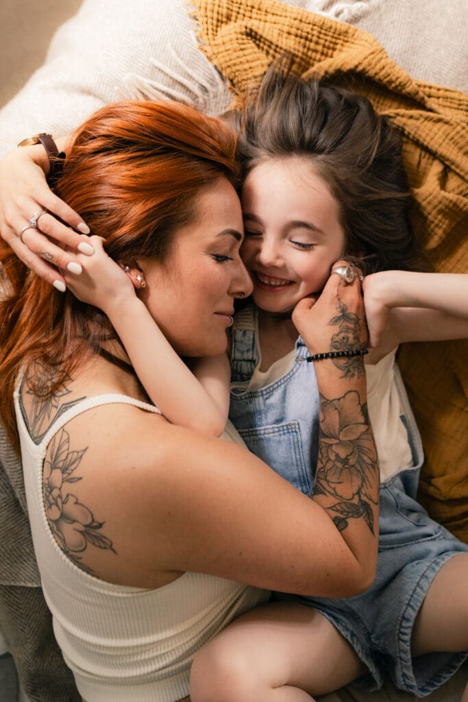 Tender moment between mother and daughter captured by Sussex family photographer