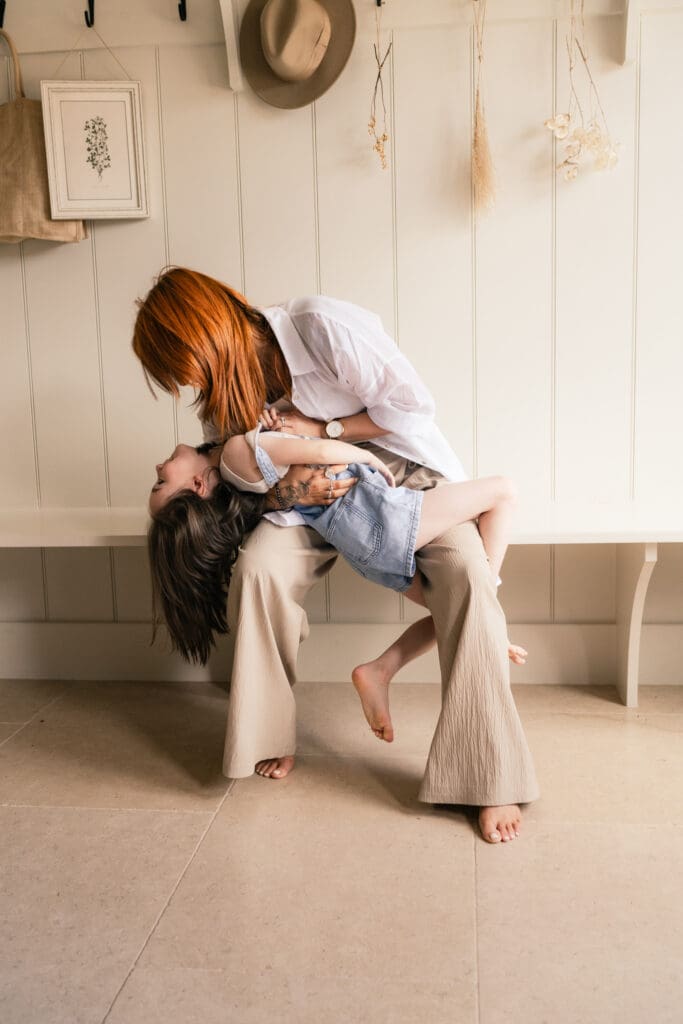 Playful interaction between mum and daughter during Sussex at-home session