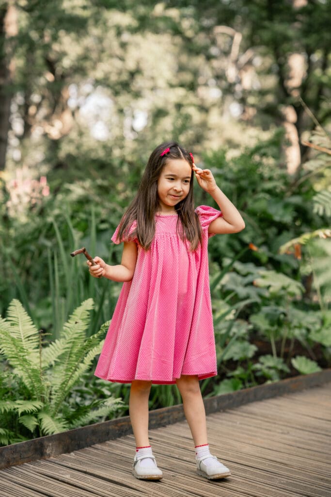 xploring nature in Sussex — a playful sibling moment during a relaxed family photoshoot.