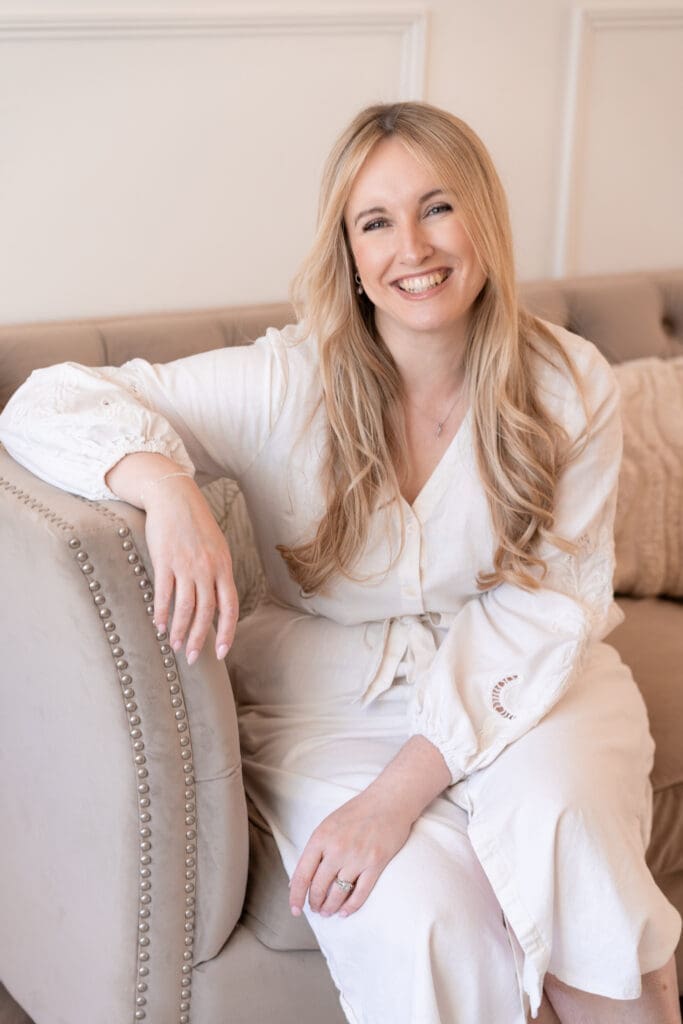 Rachel Caws bridal hair and makeup artist laughing during relaxed branding photoshoot in Sussex